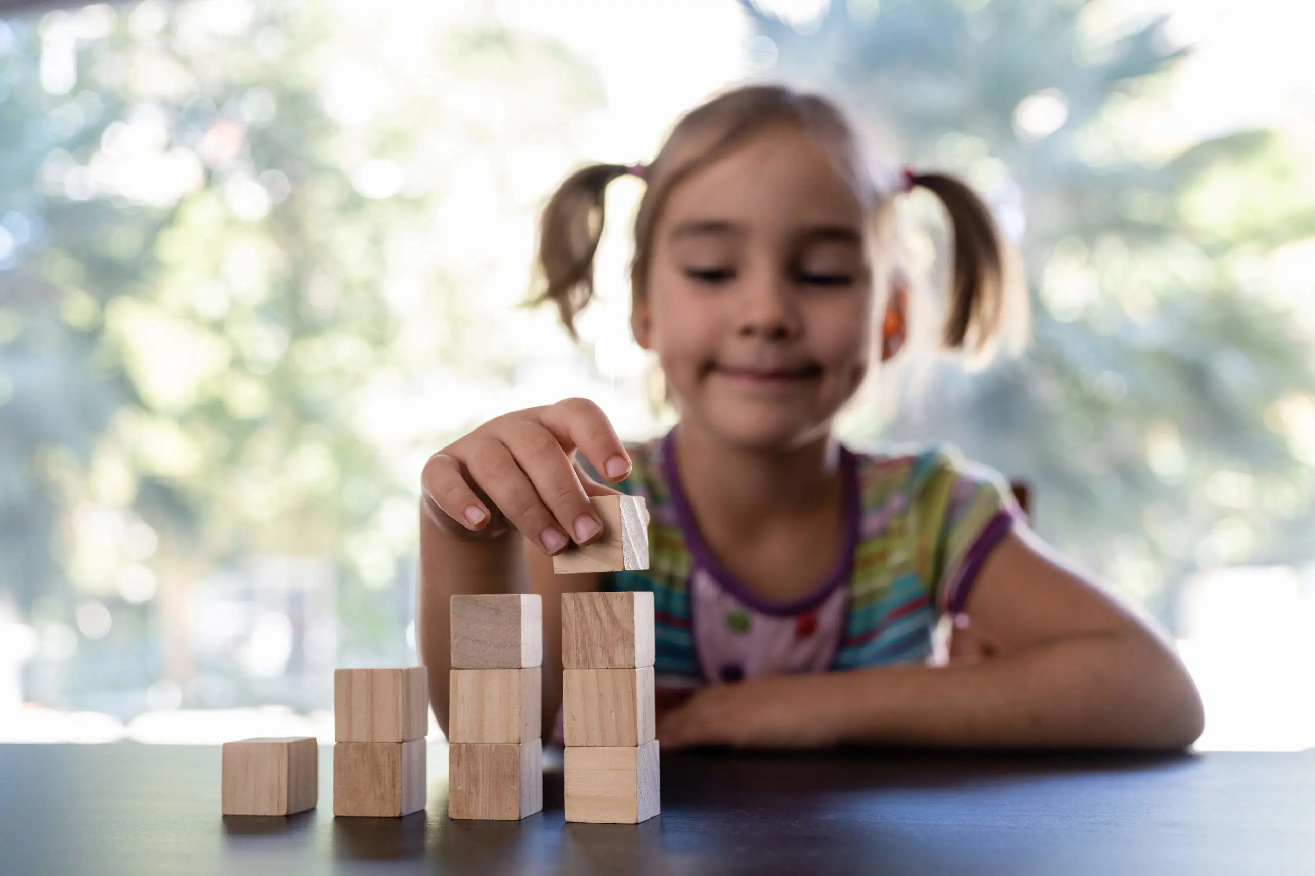 girl-playing-with-wood-blocks